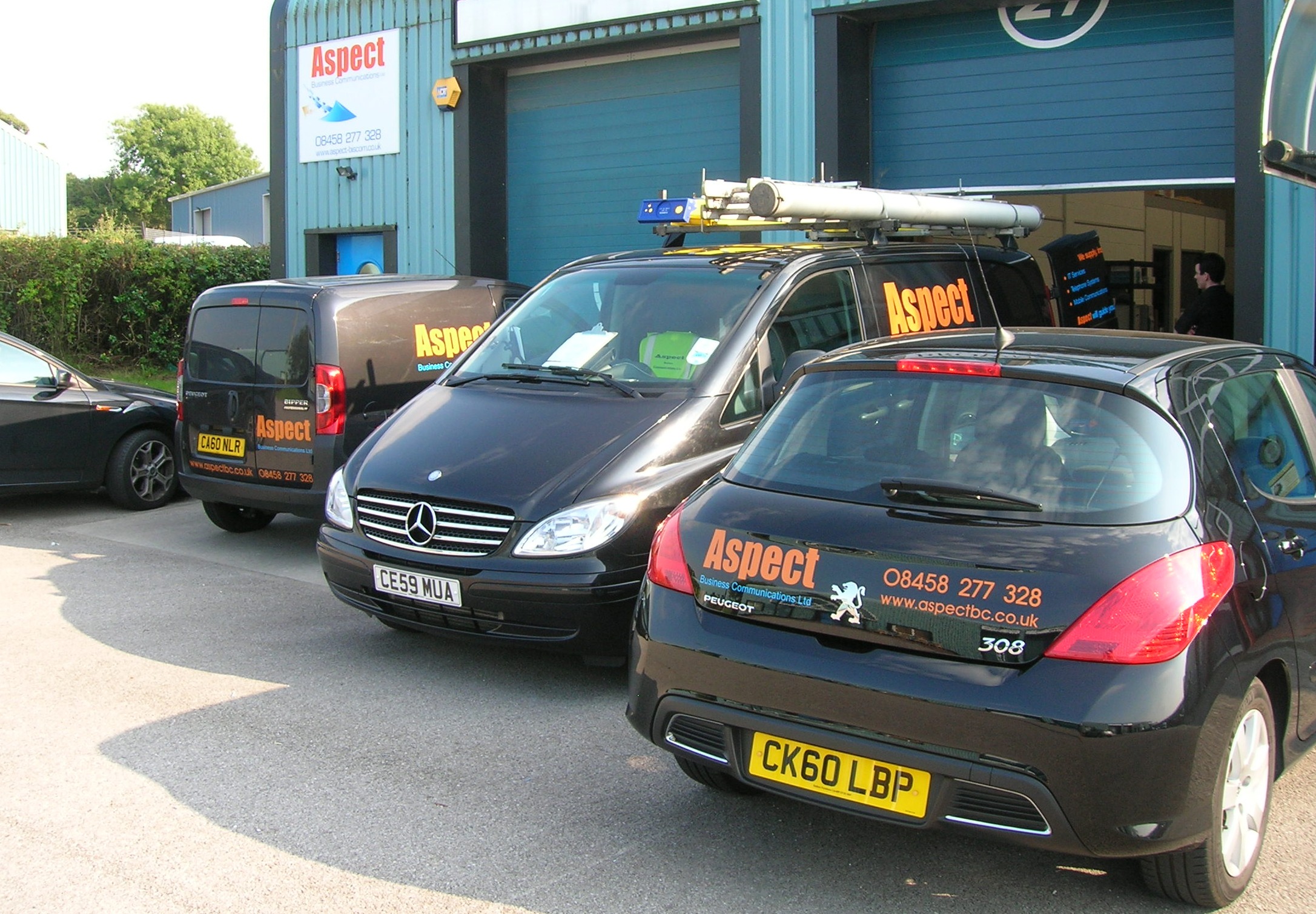 Vans-Sept11 Aspect vehicles outside of support headquarters.