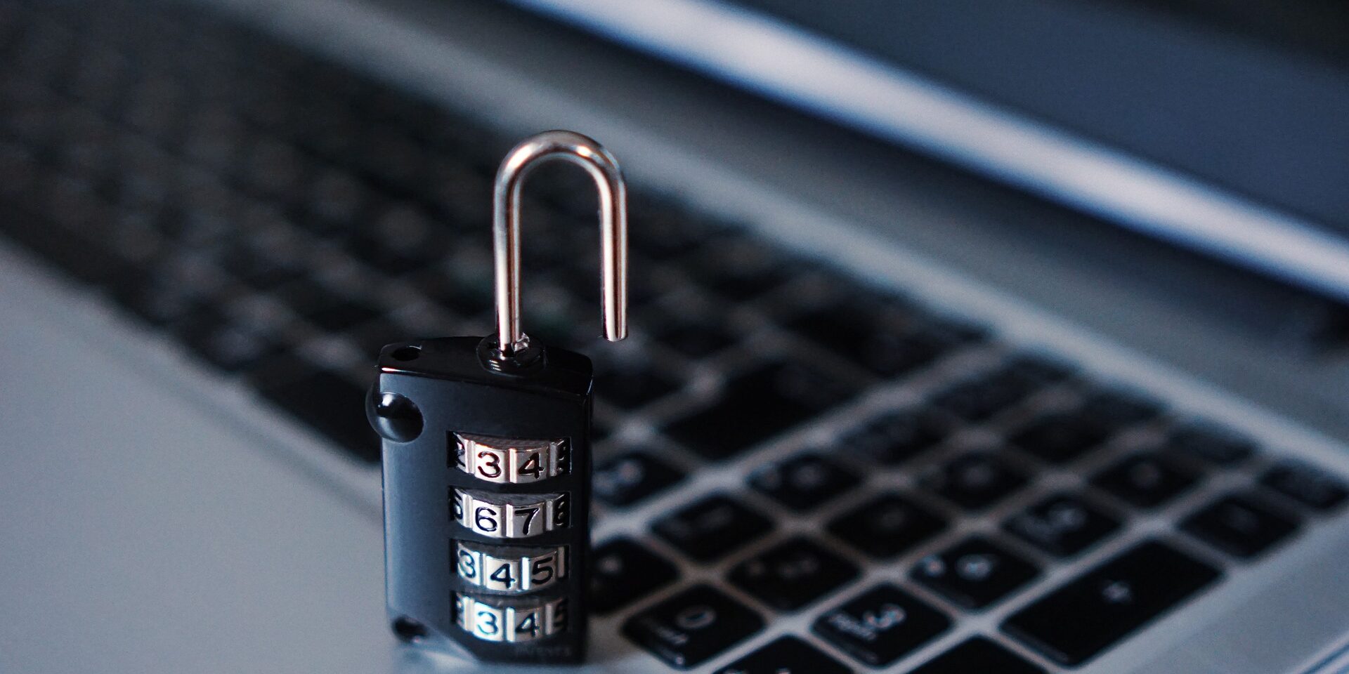 A photo of a laptop with a padlock denoting cyber security.