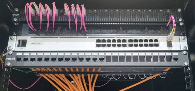 20250326_130830 A rack showing high speed fibre installation.